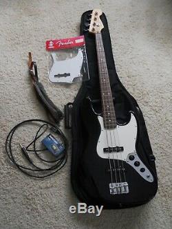 Fender Jazz Bass 4 string electric guitar, withExtra's, case, tuner, strap, & cord