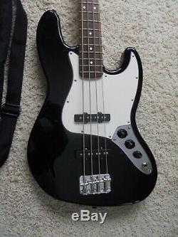 Fender Jazz Bass 4 string electric guitar, withExtra's, case, tuner, strap, & cord