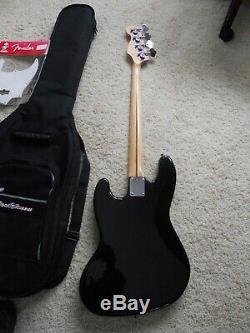 Fender Jazz Bass 4 string electric guitar, withExtra's, case, tuner, strap, & cord